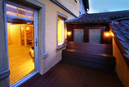 a front porch of a house with a sliding glass door at Apartment 175 qm SCHWANENNEST, in der romantischen Rödermühle an der Fränkischen Saale in Deutschlands Mitte, 8 km zur A7 in Hammelburg