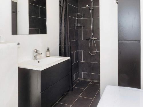 a bathroom with a sink and a shower at 4 star holiday home in Gedsted-By Traum in Gedsted
