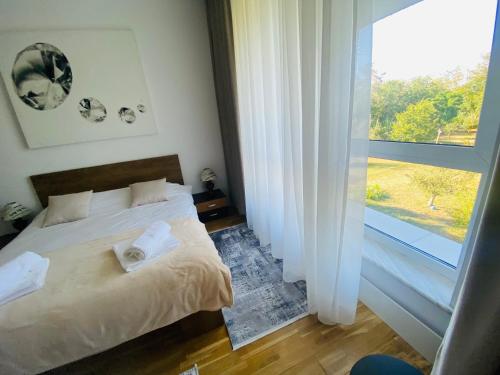 Giường trong phòng chung tại Muha ApartHotel
