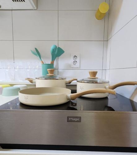 a kitchen with several pots and pans on a counter at Lemontree in Seoul