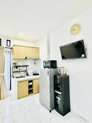 Η κουζίνα ή μικρή κουζίνα στο Cozy studio in Mataram