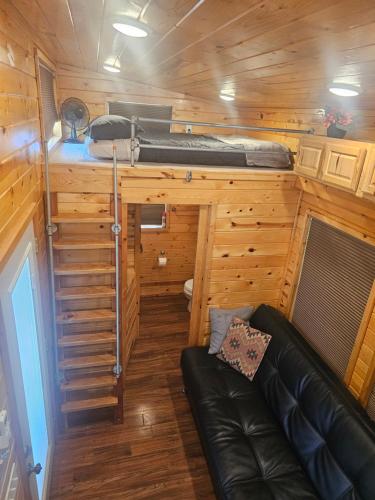 an interior view of a tiny house with a couch at JW Grand Junction in Grand Junction