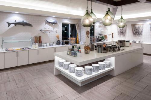 a kitchen with a counter with a shark on the wall at Residence Inn by Marriott Clearwater Beach in Clearwater Beach