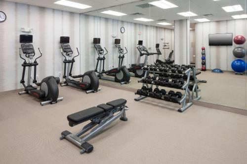 a gym with several rows of exercise machines at Residence Inn by Marriott Clearwater Beach in Clearwater Beach
