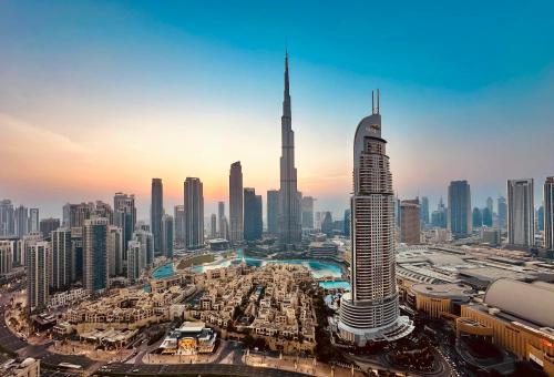 an aerial view of a city with the tallest building at Breathtaking Burj View, Sky High Luxury 2BR Apartment by 2nd Best Home in Dubai
