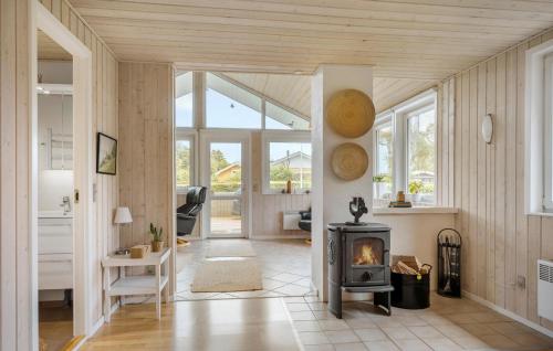 a living room with a wood stove in it at Lovely Home In Haderslev With Wifi in Haderslev