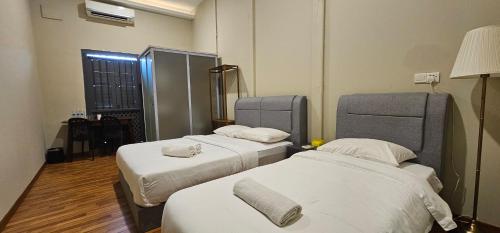 Postel nebo postele na pokoji v ubytování The Century Aigoh Hotel