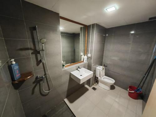 a bathroom with a shower and a toilet and a sink at Kuantan City 188 in Kuantan