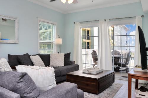 a living room with a couch and a table at Dunes Club 1A by Pristine Properties Vacation Rentals in Cape San Blas