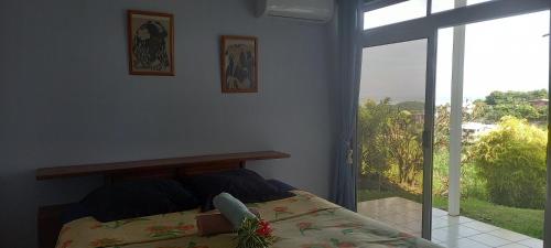 Postel nebo postele na pokoji v ubytování Kimmy Tahiti House