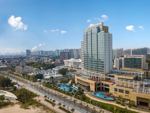 a view of a city with tall buildings and a street at Crowne Plaza Beihai Silver Beach by IHG in Beihai