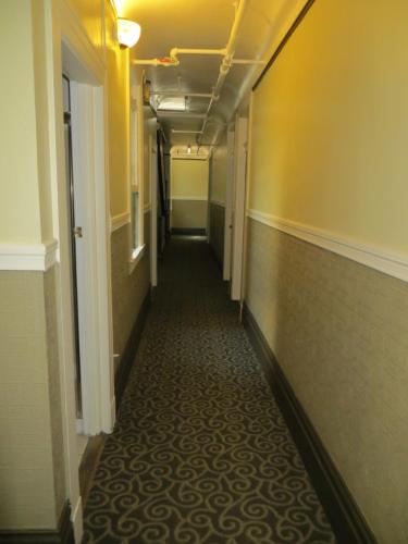 a hallway of a hotel with a long corridor at Perramont Hotel in San Francisco