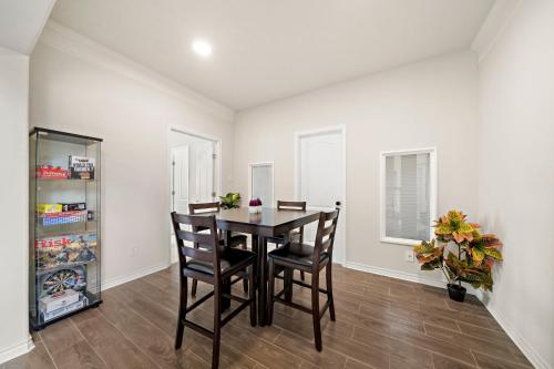 a dining room with a table and chairs at Lake Houston Getaway Pool Spa Lake Front in Humble