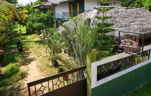 an aerial view of a house with a fence at Blue skies guest house and restaurant in Tangalle
