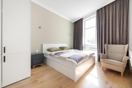 Ένα ή περισσότερα κρεβάτια σε δωμάτιο στο Apartament w centrum, przy plaży