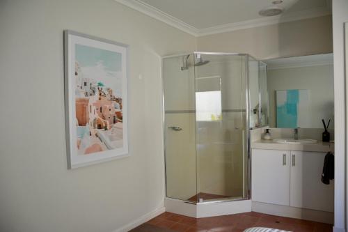 a bathroom with a shower and a sink at Ocean View Beach House, Margaret River in Gnarabup