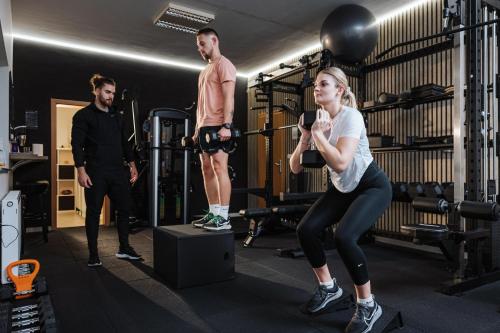 a woman standing on a box in a gym at Apartments Leonid in Podčetrtek