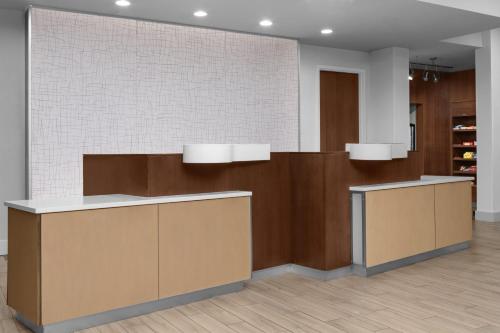 a lobby with brown and white at Fairfield Inn & Suites by Marriott Savannah Downtown Historic District in Savannah