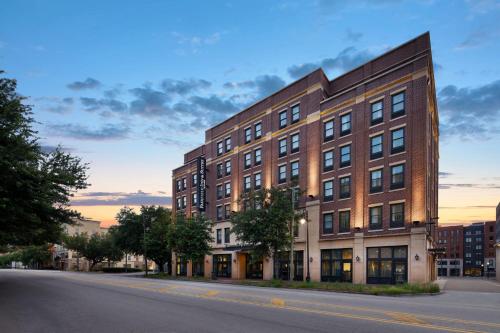 a large brick building on a city street at Fairfield Inn & Suites by Marriott Savannah Downtown Historic District in Savannah
