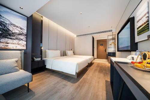 a hotel room with a bed and a desk at Atour Hotel Chengdu Phoenix Mountain Sports Park in Chengdu