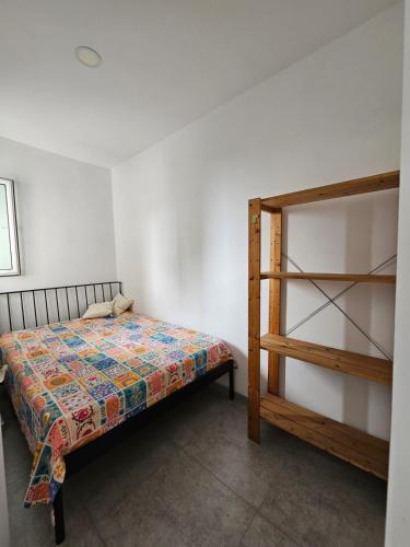 a bedroom with a bed next to a bunk bed at Gonio Apartment Seaview in Kvariati