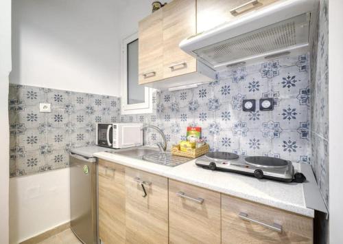 a kitchen with a toy car on the counter at Bright colourful apartment city center in Athens