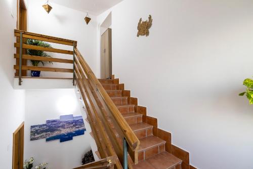 a staircase in a house with a picture on the wall at Salvo's House in Furore
