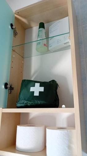 a green bag is sitting on a shelf at Attico Ostuni in Ostuni