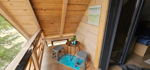 an overhead view of a tiny house with a table and two chairs at Brvnara Marinković na Sekulićima in Sekulić 