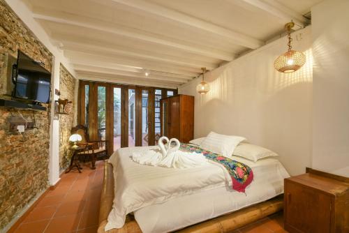 Letto o letti in una camera di Ohana House HQ