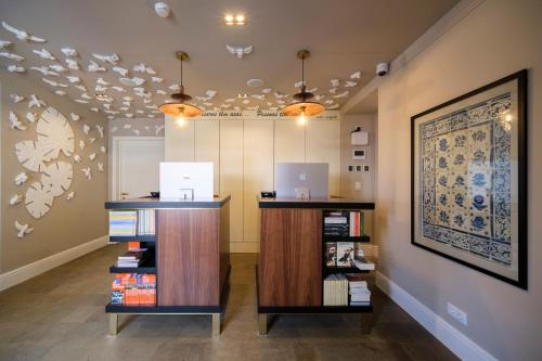 a room with a counter with books on it at Azores Book Hotel in Angra do Heroísmo