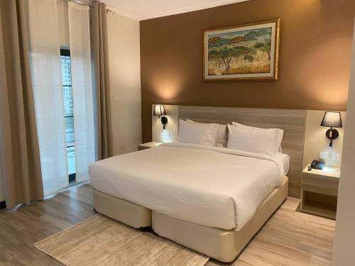 Postel nebo postele na pokoji v ubytování Bentark Hotel
