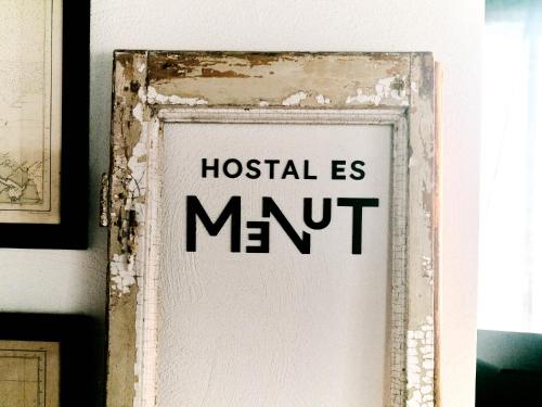 a sign that reads hospital ismit on a wall at Hostal Boutique Es Menut in Tossa de Mar