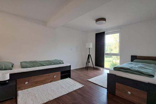 Postel nebo postele na pokoji v ubytování Ferienwohnung im Thüringer Wald