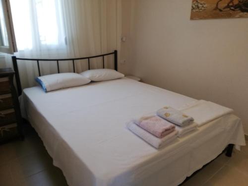 Una cama o camas en una habitación de EFThea Valley