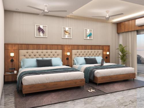 a bedroom with two beds and a wall at Prince Palace And Banquet in Pāndharkawada