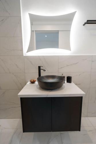 a sink on top of a counter in a bathroom at Kition Urban Suite 1 in Larnaka