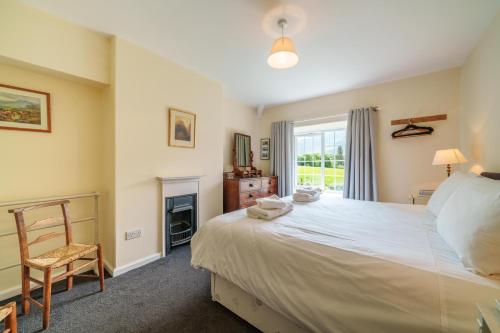 Voodi või voodid majutusasutuse 3 Gowbarrow Cottages toas