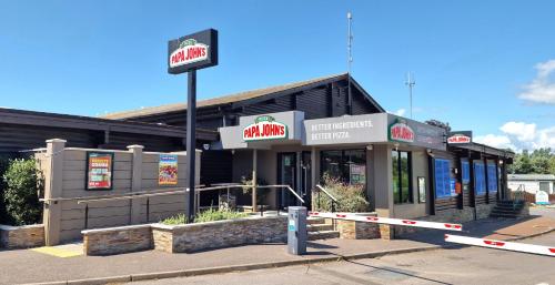 a fast food restaurant with a sign in front of it at Memories Made in Selsey
