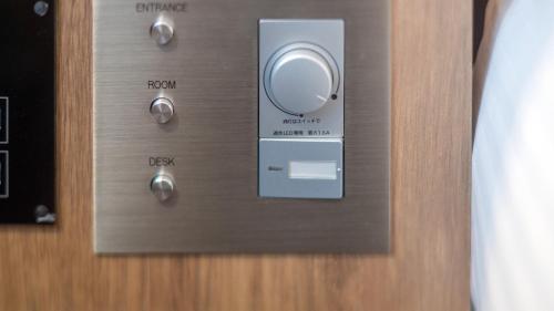 a close up of a wooden door with a knob at Hotel Global View Tsu in Tsu