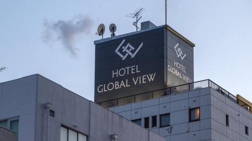a hotel global view sign on top of a building at Hotel Global View Tsu in Tsu