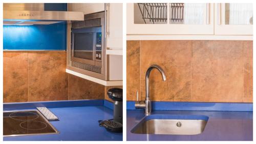 a kitchen with a sink and a microwave at El Capricho de Toledo in Toledo