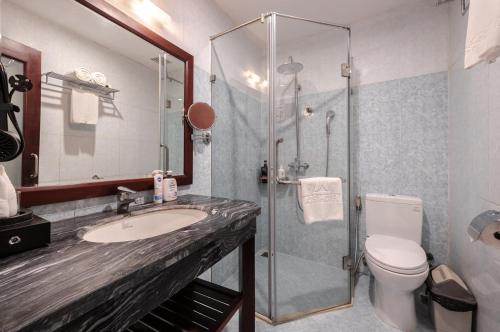 a bathroom with a shower and a sink and a toilet at A25 Hotel - 63A Phương Liệt in Hanoi