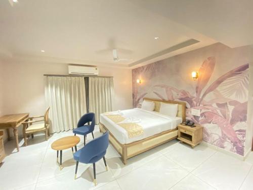 Voodi või voodid majutusasutuse Ariena by Spree Hotels Goa toas