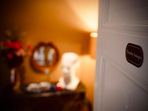 a close up of a door with a mirror at L'Amarante chambres d'hôtes OU gîte citadin in Theux