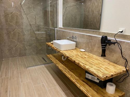 a bathroom with a sink and a mirror at Filoxenia Sea View in Parga