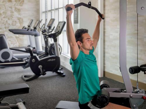 a man exercising on a treadmill in a gym at The William Inglis Mgallery in Warwick Farm