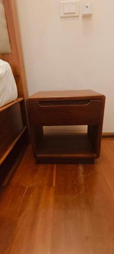 a wooden drawer in the corner of a room at Happy hour boutiquehotel in Luang Prabang