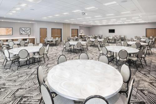 a large room with tables and chairs in it at Hyatt Place Munster in Munster