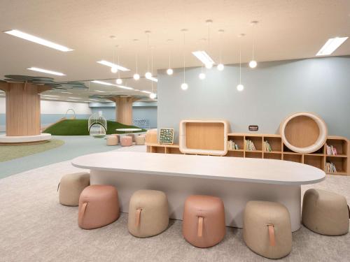 a meeting room with a table and chairs at Grand Mercure Nasu Highlands Resort & Spa in Nasu